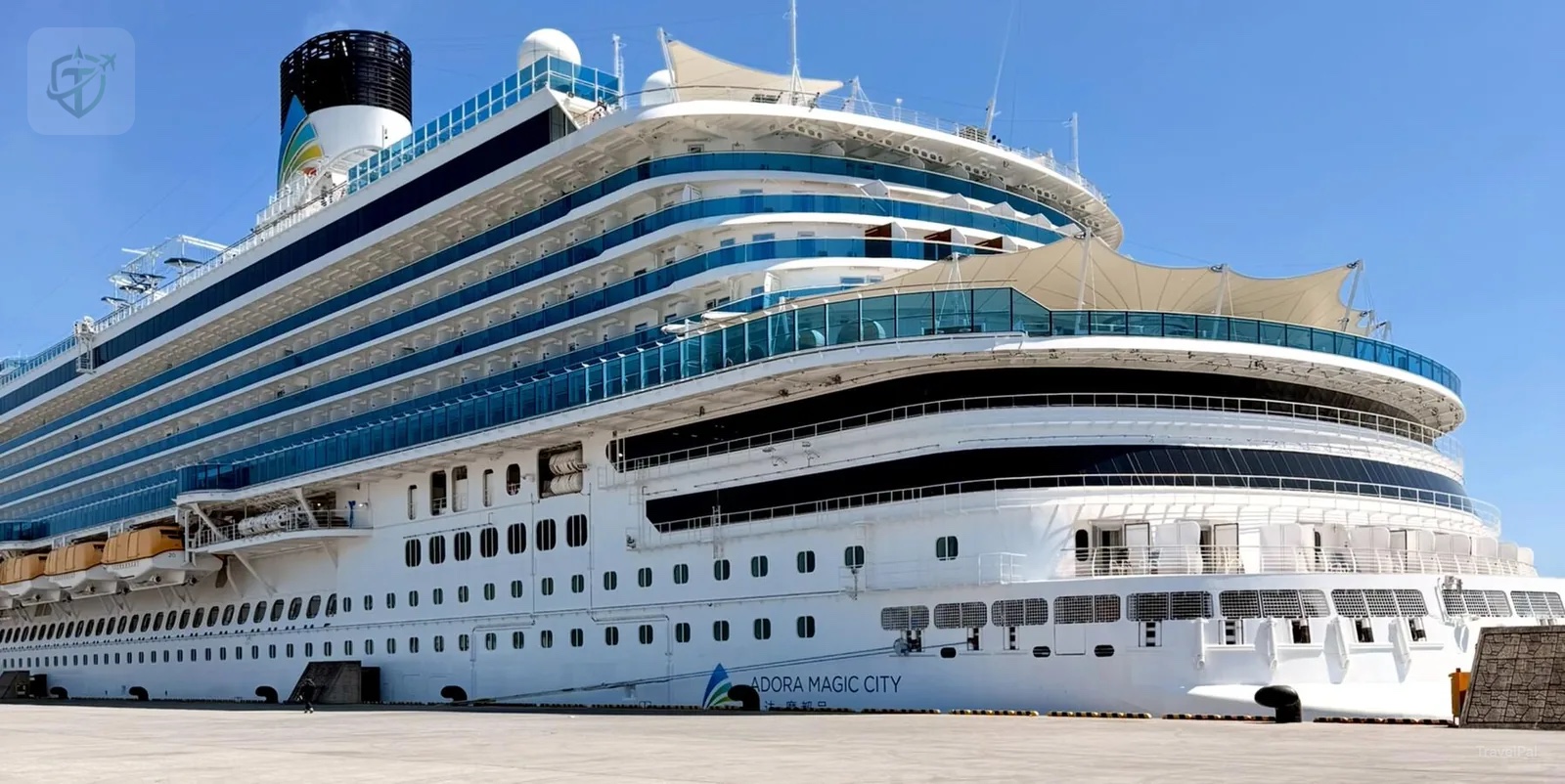 Adora Magic City cruise ship docked in port beneath a clear blue sky