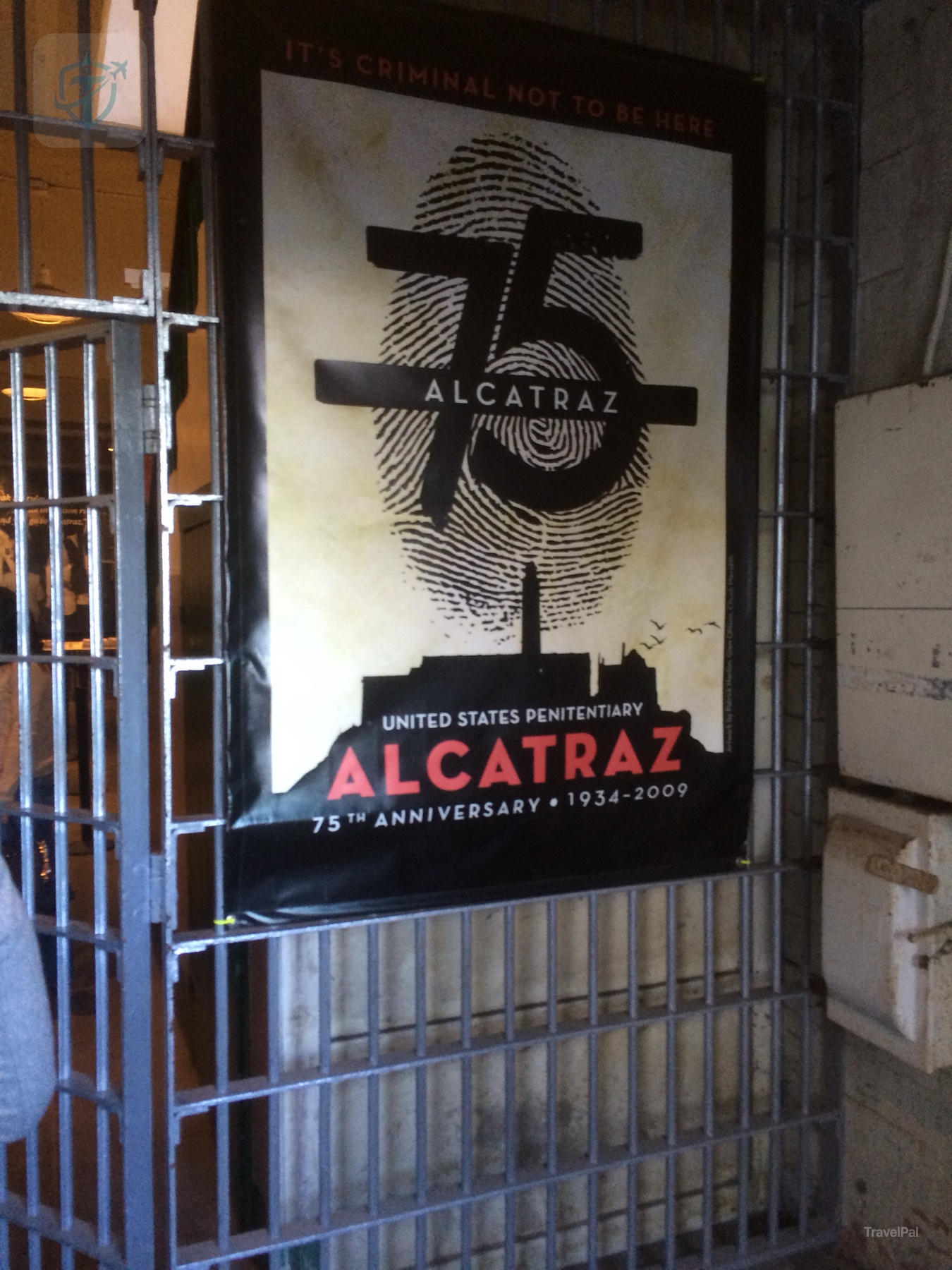 Alcatraz exhibit sign displayed behind bars inside the cellhouse