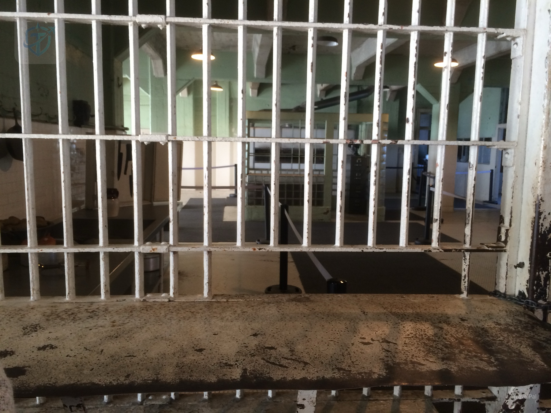Rows of metal-barred cells extending along a corridor inside the Alcatraz cellhouse