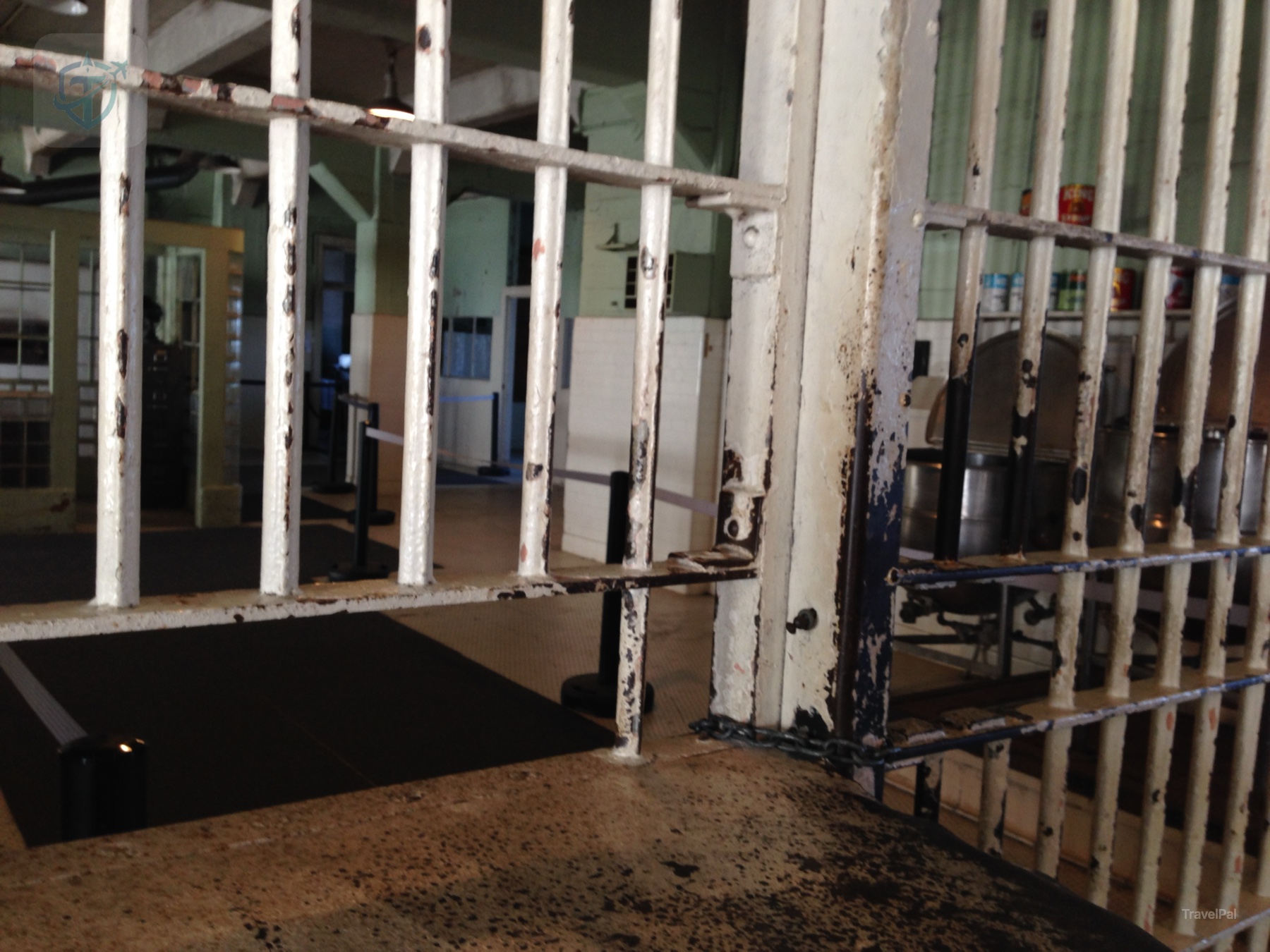 Empty Alcatraz exercise yard enclosed by high concrete walls and fencing