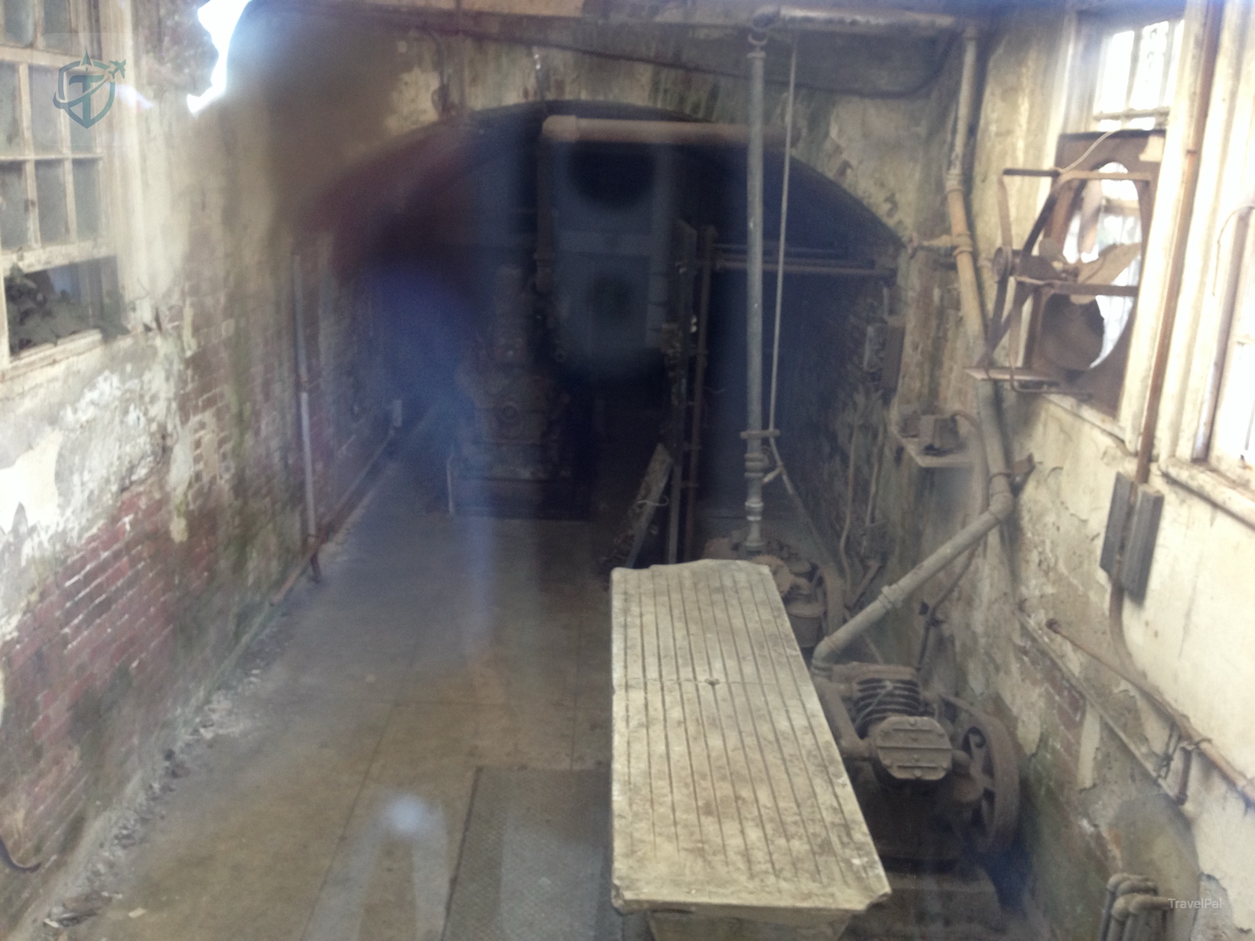 Dim service tunnel inside an older Alcatraz building