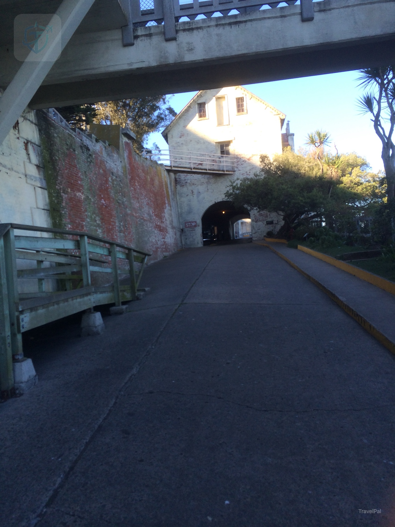 Paved uphill path leading from the Alcatraz dock toward the former cellhouse