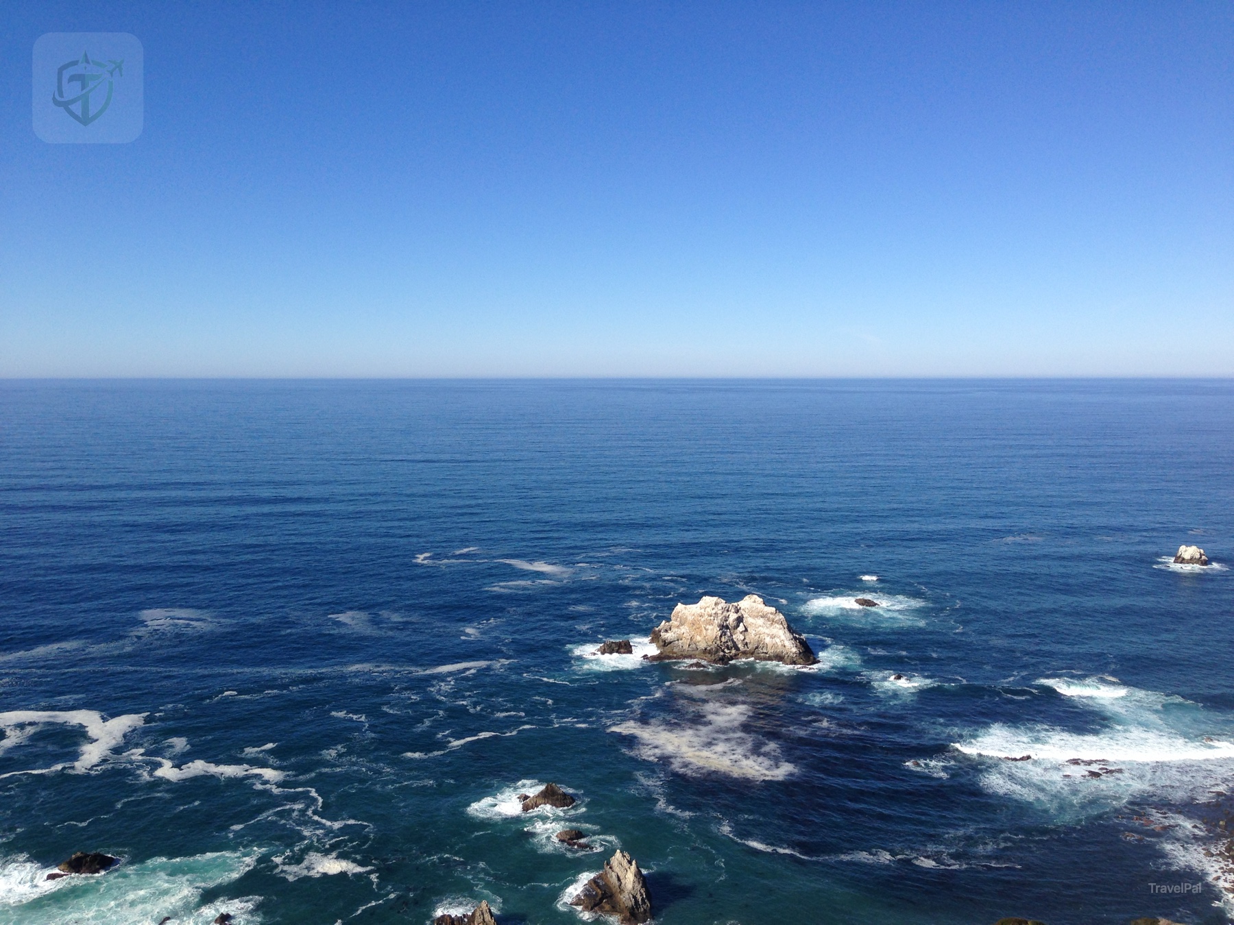 Open Pacific horizon with sea stacks below the California coast