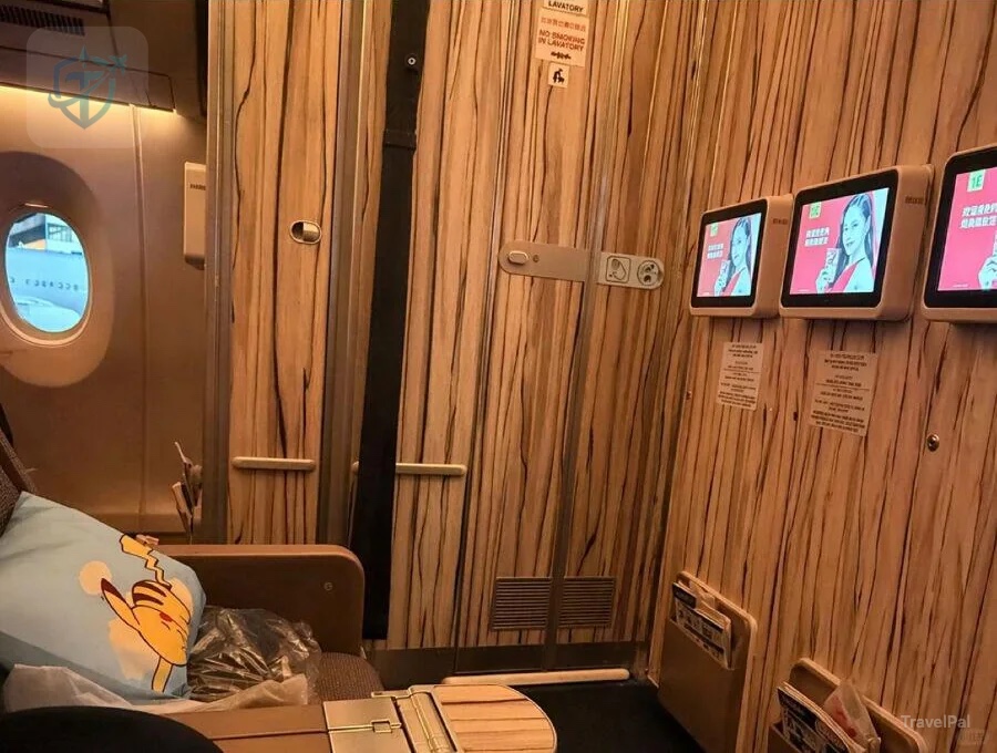 China Airlines A350 premium-economy cabin with persimmon wood-grain finish