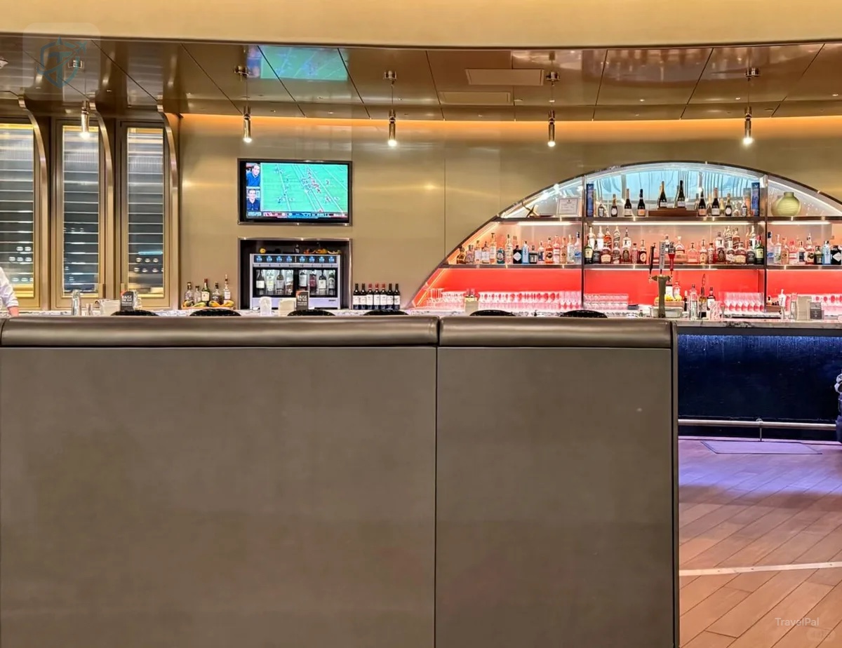 Long illuminated bar inside the Delta Sky Club near Gate G18 at MSP