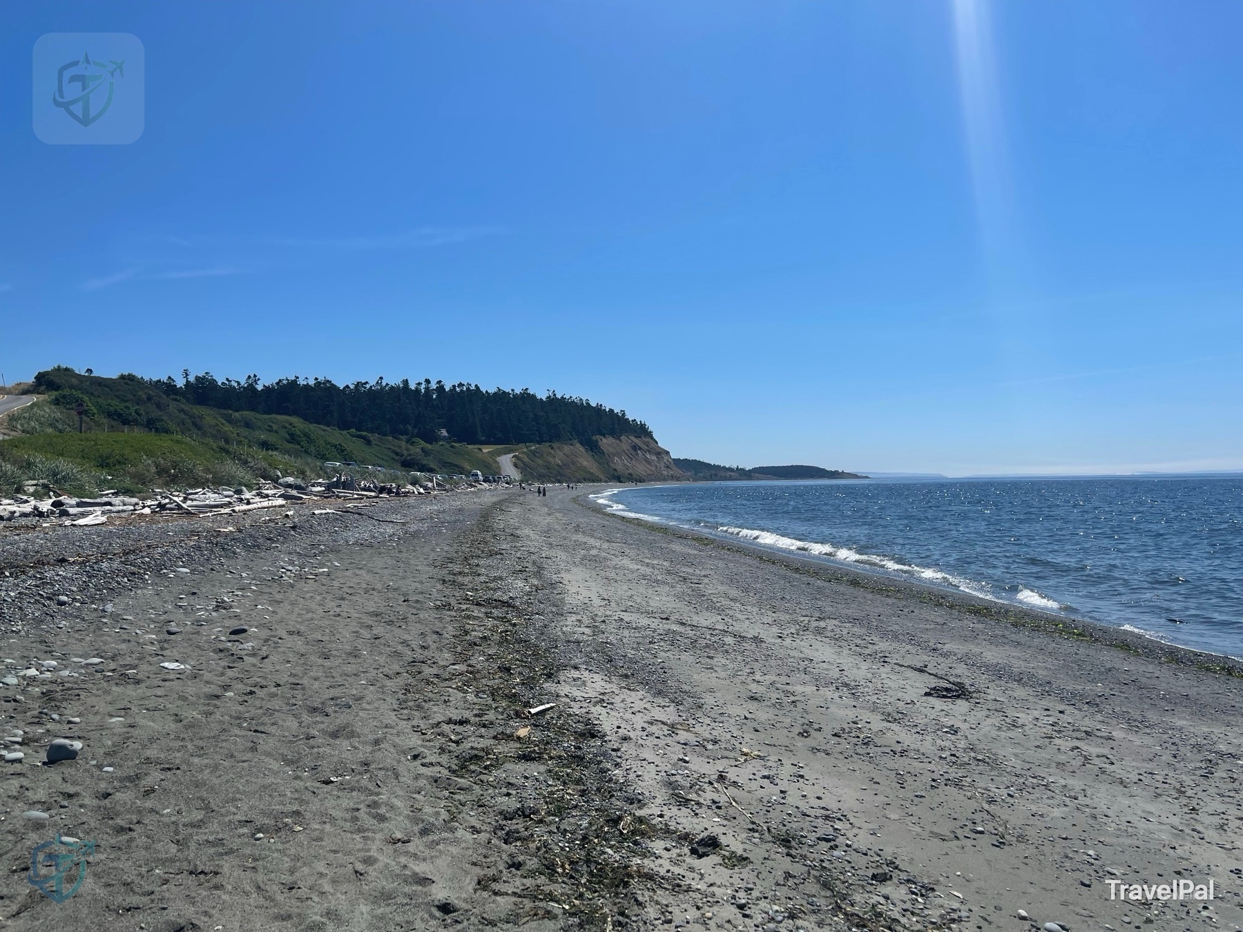 Pebble and sand beach curving beneath the bluff at Ebey’s Landing on Whidbey Island