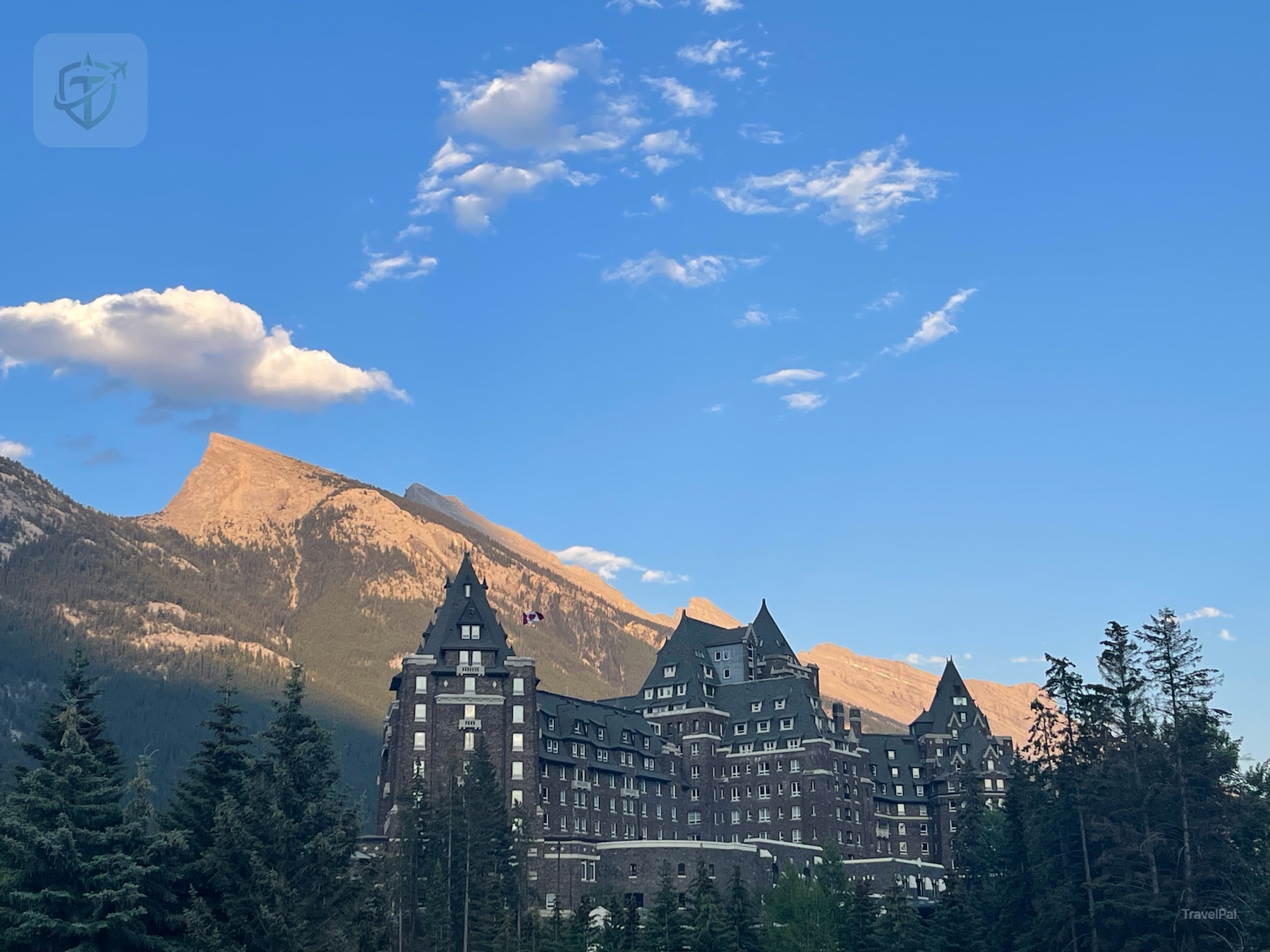Fairmont Banff Springs hotel beneath the Rocky Mountains at sunset