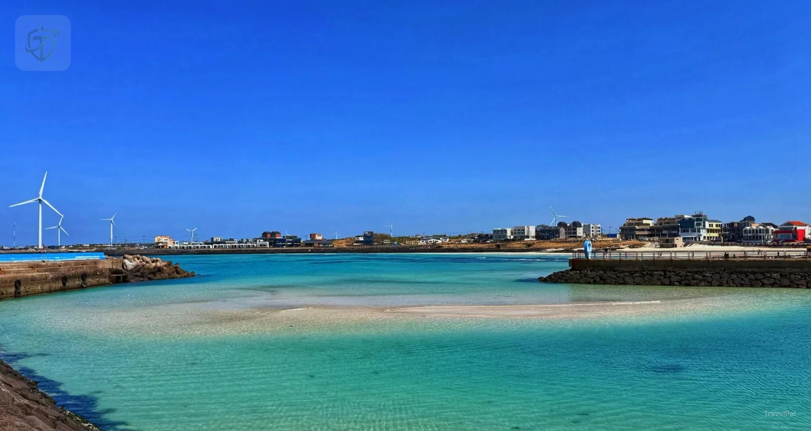 Turquoise water and offshore wind turbines along Jeju's west coast