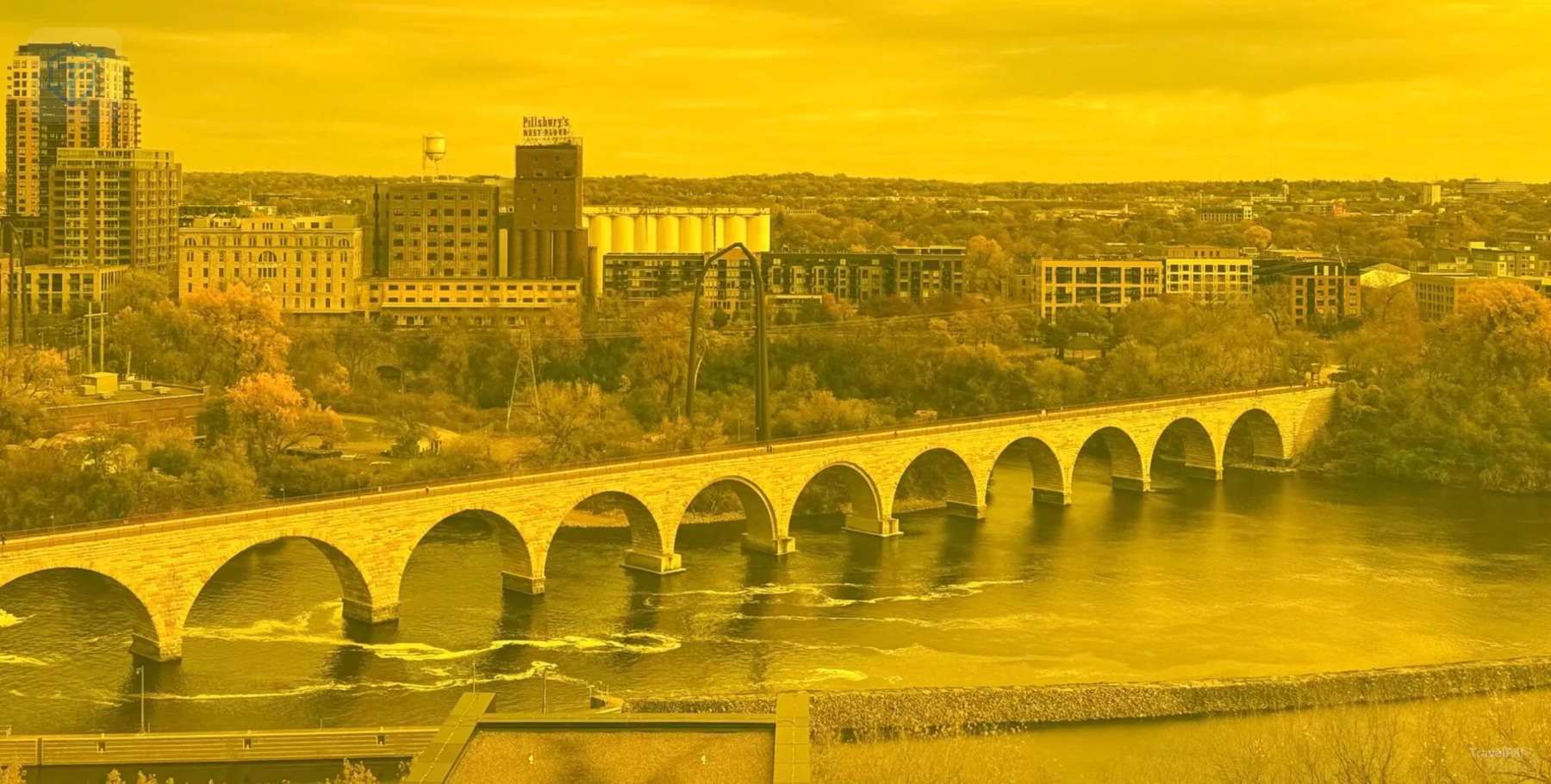 Golden-tinted view of Stone Arch Bridge and the Mississippi from the Guthrie Amber Box