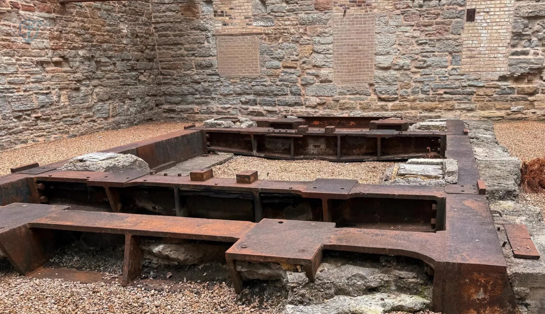 Exposed stone and timber foundations in Mill Ruins Park