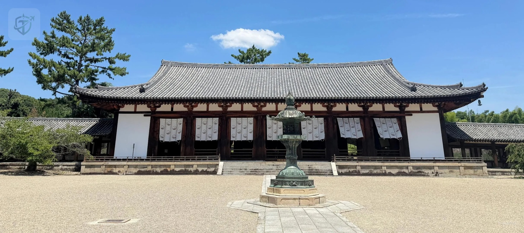 Long wooden temple hall across the quiet courtyard at Hōryū-ji