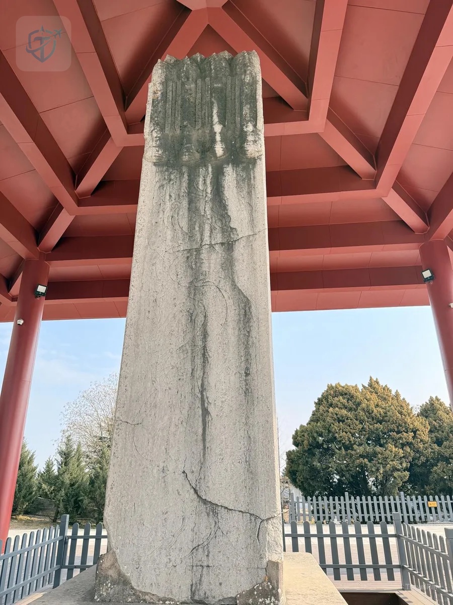 Wu Zetian's monumental Wordless Stele beneath a red protective pavilion at Qianling Mausoleum