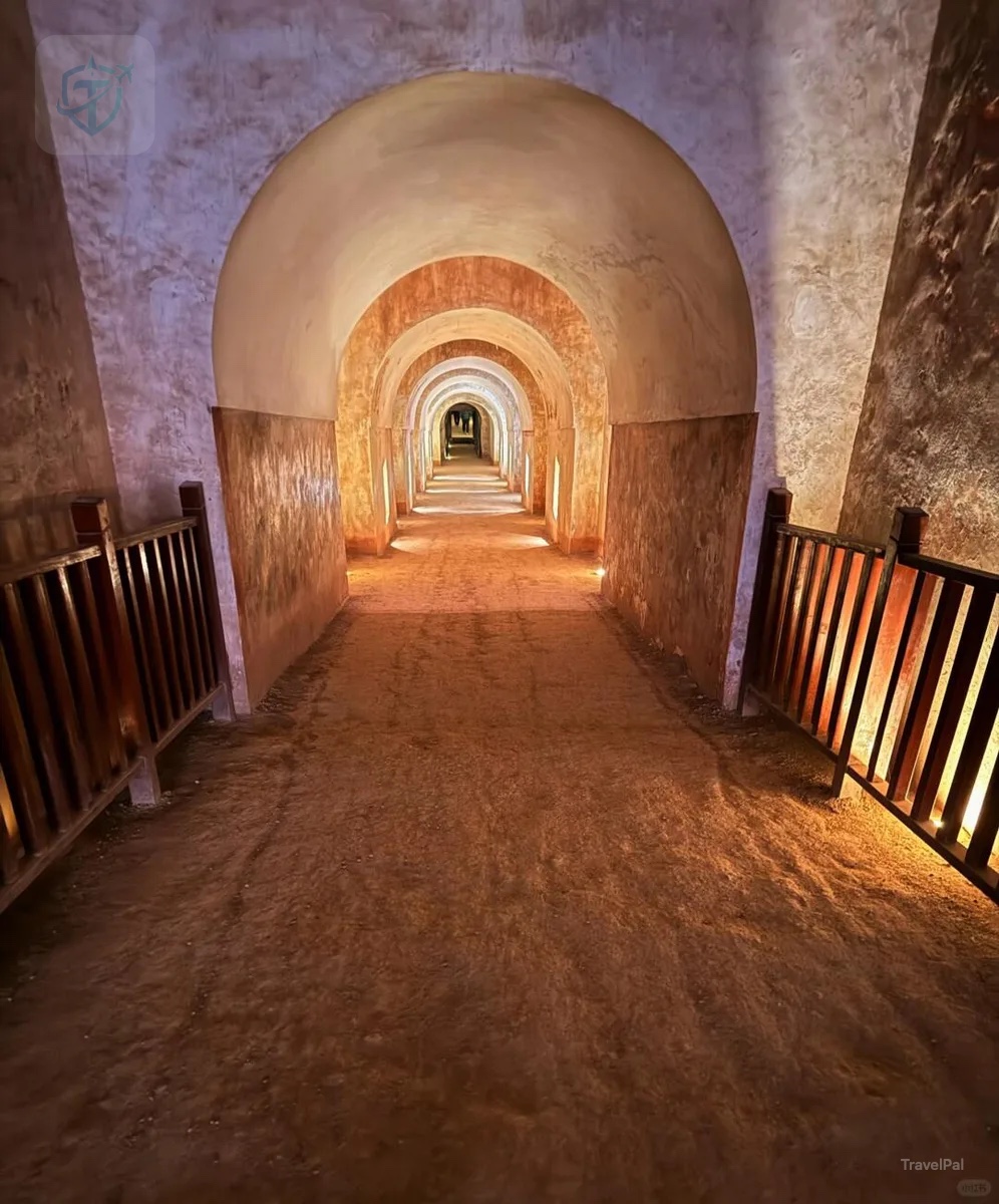 Long illuminated vaulted passage descending through Princess Yongtai's tomb at Qianling