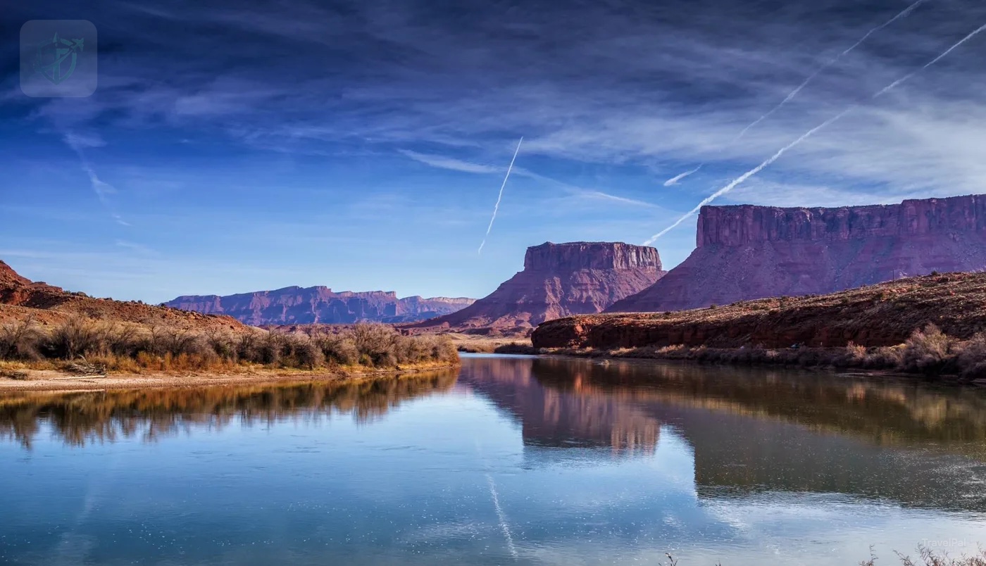 Still water reflecting desert cliffs in Utah
